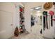 Bright, well-organized walk-in closet with shelving, rods and hats and bags for accessories at 4249 Millside Walk, Smyrna, GA 30080