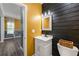 Stylish half-bathroom featuring modern fixtures and a vanity with a marble countertop at 4306 Thorngate Ln, Acworth, GA 30101