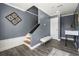 Inviting entryway with hardwood floors, modern decor, and staircase leading to upper level at 4306 Thorngate Ln, Acworth, GA 30101