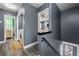 Upstairs hallway with laundry area and a view into the bedroom through the partition at 4306 Thorngate Ln, Acworth, GA 30101