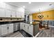 Bright kitchen with granite countertops, stainless steel appliances, breakfast bar, and seamless dining area access at 4306 Thorngate Ln, Acworth, GA 30101