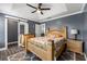 Comfortable main bedroom with trey ceiling, slider barn door closet, and side-by-side nightstands at 4306 Thorngate Ln, Acworth, GA 30101