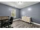 Office or flex room with a large desk and chair, suitable for working from home at 4306 Thorngate Ln, Acworth, GA 30101