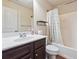 Bathroom with vanity, sink, and shower-tub combination with a white curtain at 7514 Absinth Dr Pass, Atlanta, GA 30349