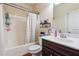 Bathroom with a tub and shower combination and ample counter space at 7514 Absinth Dr Pass, Atlanta, GA 30349