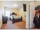 Bedroom with a TV, closet, and window providing natural light at 7514 Absinth Dr Pass, Atlanta, GA 30349