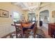 Elegant dining room with a large table, chandelier, and stylish decor at 7514 Absinth Dr Pass, Atlanta, GA 30349