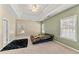 Spacious bedroom featuring trey ceilings and natural light streaming through multiple windows at 79 Tiffany Trce, Palmetto, GA 30268