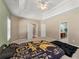Comfortable bedroom with ceiling fan, natural lighting, trey ceilings, and a doorway to the bathroom at 79 Tiffany Trce, Palmetto, GA 30268