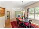 Charming breakfast nook next to fireplace filled with light and a dining set at 79 Tiffany Trce, Palmetto, GA 30268
