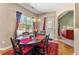 Dining area with hardwood floors, a chandelier, and plenty of natural light at 79 Tiffany Trce, Palmetto, GA 30268
