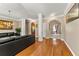 Inviting living area featuring hardwood floors, elegant columns, and neutral paint colors at 79 Tiffany Trce, Palmetto, GA 30268