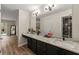 Bathroom featuring dual sinks, granite countertops, and large mirror at 1720 Little Willeo Rd, Marietta, GA 30068