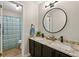 Bathroom features double sinks, granite counters, dark cabinets, and updated fixtures at 1720 Little Willeo Rd, Marietta, GA 30068