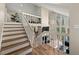The staircase leads to a spacious living area with large windows providing ample natural light at 1720 Little Willeo Rd, Marietta, GA 30068