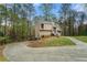 This home features lush greenery and a winding driveway leading to the beautiful exterior at 1720 Little Willeo Rd, Marietta, GA 30068
