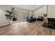 Living room features a fireplace, hardwood floors, and access to a deck with trees in view at 1720 Little Willeo Rd, Marietta, GA 30068