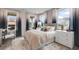 Comfortable bedroom with large windows, neutral carpet, and light walls at 3048 Shirecrest Ln, Dacula, GA 30019