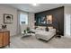 Bonus room features dark accent wall, comfortable seating, and natural light at 3048 Shirecrest Ln, Dacula, GA 30019
