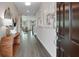 Welcoming foyer with stylish decor, wood-look floors, and an open view into the living area at 3048 Shirecrest Ln, Dacula, GA 30019