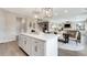 Open-concept kitchen island overlooks the dining area, creating an inviting space for gatherings at 3048 Shirecrest Ln, Dacula, GA 30019
