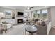 Cozy living room featuring a fireplace, recessed lighting, and plush seating at 3048 Shirecrest Ln, Dacula, GA 30019