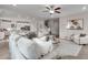 Spacious living area with modern furnishings, stylish decor, and an adjacent kitchen at 3048 Shirecrest Ln, Dacula, GA 30019