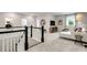 Loft area with comfortable seating, natural light, and stylish decor, creating a relaxing upstairs retreat at 3048 Shirecrest Ln, Dacula, GA 30019