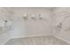 Spacious walk-in closet features shelving, hanging racks, and neutral carpet at 3048 Shirecrest Ln, Dacula, GA 30019