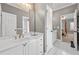 Bright bathroom featuring a single sink, white cabinets, and tile floors at 3230 Munsey Ct, Cumming, GA 30041