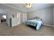 Spacious bedroom featuring a double bed, neutral colors, and a ceiling fan at 3230 Munsey Ct, Cumming, GA 30041