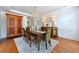 Charming dining room with chandelier and access to the kitchen at 3230 Munsey Ct, Cumming, GA 30041
