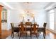 Formal dining room with chandelier and elegant furnishings at 3230 Munsey Ct, Cumming, GA 30041