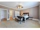 Spacious primary bedroom with neutral walls, ceiling fan, connecting to a bathroom and featuring double closets at 3230 Munsey Ct, Cumming, GA 30041