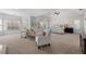 Large main bedroom featuring tray ceilings, lots of windows, and neutral color palette at 3230 Munsey Ct, Cumming, GA 30041