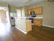 Functional kitchen with stainless steel appliances, breakfast bar, and ample counter space at 3615 Hutchinson Trace Dr, Cumming, GA 30040