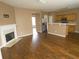 Inviting living space with fireplace, hardwood floors, and access to the kitchen at 3615 Hutchinson Trace Dr, Cumming, GA 30040