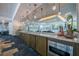 Bar with cabinets, marble countertop, mirror backsplash, and soft lighting at 44 Peachtree Nw Pl # 629, Atlanta, GA 30309