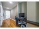 Hallway with a desk and modern computer setup, with hardwood floors and two doors at 44 Peachtree Nw Pl # 629, Atlanta, GA 30309
