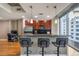 Well-lit kitchen featuring a breakfast bar, stainless steel appliances, and granite countertops at 44 Peachtree Nw Pl # 629, Atlanta, GA 30309