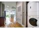 Open-concept living space with hardwood floors, modern kitchen, washer and dryer, and natural light at 44 Peachtree Nw Pl # 629, Atlanta, GA 30309