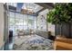 Inviting lobby area with chairs, side tables, accent furniture and fixtures, and large windows at 44 Peachtree Nw Pl # 629, Atlanta, GA 30309