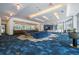 Bright lounge featuring comfortable seating, modern lighting, and a refreshment area at 44 Peachtree Nw Pl # 629, Atlanta, GA 30309