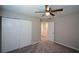 Bedroom featuring closet, neutral walls, plush carpeting and a ceiling fan at 5660 Sable Bay Pt, Atlanta, GA 30349
