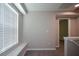 Sitting area on the upper level featuring a large window providing ample natural light at 5660 Sable Bay Pt, Atlanta, GA 30349