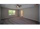 Spacious bedroom with plush carpet, ceiling fan and natural light from the window at 5660 Sable Bay Pt, Atlanta, GA 30349