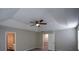 Bedroom featuring a ceiling fan and a door leading to a bathroom at 5660 Sable Bay Pt, Atlanta, GA 30349