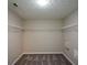 Walk-in closet with adjustable wire shelving and neutral paint at 5660 Sable Bay Pt, Atlanta, GA 30349