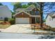 Beautiful brick-front home with an attached two-car garage and a well-maintained lawn at 5660 Sable Bay Pt, Atlanta, GA 30349