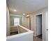 Hallway showing multiple doorways with carpet flooring at 5660 Sable Bay Pt, Atlanta, GA 30349